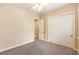 Bedroom featuring neutral walls, plush carpet, closet and standard door at 7332 Redhead Dr, North Las Vegas, NV 89084