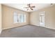Bedroom with carpet flooring, ceiling fan and outside access to a balcony at 7332 Redhead Dr, North Las Vegas, NV 89084