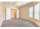 A clean bedroom featuring plush carpet, neutral walls, and walk-in closet at 7332 Redhead Dr, North Las Vegas, NV 89084