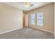 Spacious bedroom featuring neutral paint, carpet flooring, ceiling fan and natural light at 7332 Redhead Dr, North Las Vegas, NV 89084