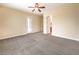 Spacious bedroom with carpet flooring, ceiling fan and natural lighting at 7332 Redhead Dr, North Las Vegas, NV 89084