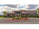 Elegant clubhouse with a fountain, lush landscaping, and beautiful architecture at 7332 Redhead Dr, North Las Vegas, NV 89084