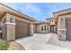 Beautiful home showcasing meticulous landscaping and an inviting driveway leading to a two-car garage at 7332 Redhead Dr, North Las Vegas, NV 89084