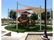 Community playground featuring slides, covered seating, and modern design at 7332 Redhead Dr, North Las Vegas, NV 89084