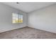 Bedroom with plush carpet and natural light at 7505 Emerald Stars St # 101, North Las Vegas, NV 89084