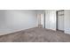 Bedroom with plush carpet, open door, and closet at 7505 Emerald Stars St # 101, North Las Vegas, NV 89084
