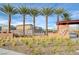 Elegant community entrance with Valley Vista signage, palm trees, and desert landscaping at 7505 Emerald Stars St # 101, North Las Vegas, NV 89084