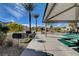 A community space featuring picnic tables under a covered pavilion with trees and neighborhood landscaping at 7505 Emerald Stars St # 101, North Las Vegas, NV 89084