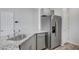 Kitchen featuring stainless steel appliances and gray shaker cabinets at 7505 Emerald Stars St # 101, North Las Vegas, NV 89084