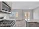 Modern kitchen featuring stainless steel appliances and granite countertops at 7505 Emerald Stars St # 101, North Las Vegas, NV 89084