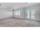 Large living room with neutral carpeting and natural light at 7505 Emerald Stars St # 101, North Las Vegas, NV 89084