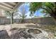 Backyard features desert landscaping, stone accents, and a block wall fence at 7865 March Brown Ave, Las Vegas, NV 89149