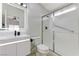 Modern bathroom featuring a glass shower, toilet, and vanity with a lighted mirror at 7865 March Brown Ave, Las Vegas, NV 89149