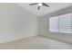 Bright bedroom featuring vaulted ceiling, neutral walls, and window with modern blinds at 7865 March Brown Ave, Las Vegas, NV 89149