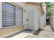 Inviting home entrance featuring a secure screen door and a sunlit window at 7865 March Brown Ave, Las Vegas, NV 89149