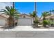 Charming single-story home featuring a well-maintained yard with palm trees and a spacious two-car garage at 7865 March Brown Ave, Las Vegas, NV 89149