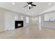 Bright open-concept living room with vaulted ceilings, hardwood floors, and stylish fireplace at 7865 March Brown Ave, Las Vegas, NV 89149