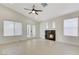 Bright living room with vaulted ceilings, hardwood floors and cozy fireplace at 7865 March Brown Ave, Las Vegas, NV 89149