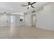 Bright, open-concept living space with vaulted ceilings and hardwood floors, seamlessly connected to the kitchen at 7865 March Brown Ave, Las Vegas, NV 89149