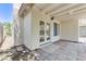 Covered patio area with French doors and a tiled surface at 7865 March Brown Ave, Las Vegas, NV 89149