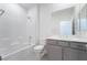 Bathroom features a shower-tub combo, toilet, and a sink with shaker cabinets at 789 Black Palace St, Henderson, NV 89011