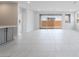 Bright and airy living room with sliding glass doors and tile flooring; great flow from kitchen at 789 Black Palace St, Henderson, NV 89011