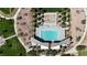 Beautiful aerial shot of community pool featuring lounge chairs, splash pad, and shaded areas at 789 Drammatico Pl, Henderson, NV 89011