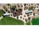 Community park with playground featuring unique structures, mature landscaping, and a covered picnic area at 789 Drammatico Pl, Henderson, NV 89011