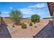 Wide view of the backyard with low maintenance landscaping at 789 Drammatico Pl, Henderson, NV 89011