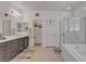 Bathroom with a double vanity, enclosed shower, and separate toilet room at 789 Drammatico Pl, Henderson, NV 89011