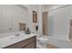 Bathroom featuring a single sink vanity, tub and white walls at 789 Drammatico Pl, Henderson, NV 89011