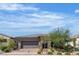 Charming single-story home boasts a well-manicured front yard and a two-car garage at 789 Drammatico Pl, Henderson, NV 89011