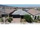 Aerial view of the house showing the roof, landscaping, and surrounding neighborhood at 789 Drammatico Pl, Henderson, NV 89011