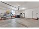 Well-lit garage interior with storage shelves and ample space at 789 Drammatico Pl, Henderson, NV 89011