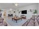 Open-concept living room with views of the dining area, boasting abundant light, ceiling fans and attractive decor at 789 Drammatico Pl, Henderson, NV 89011