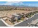 Residential aerial view showing well-kept neighborhood, desert surroundings, and mountain backdrop at 8261 Selenite St, Las Vegas, NV 89113