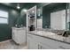 Modern bathroom with double granite vanity and well-lit walk-in closet at 8261 Selenite St, Las Vegas, NV 89113