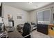 Bedroom with a bed, desk, and window, perfect for relaxation and study at 8261 Selenite St, Las Vegas, NV 89113