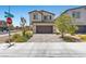 Charming two-story home with a brick driveway and well-maintained landscaping at 8261 Selenite St, Las Vegas, NV 89113
