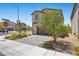 Charming two-story home featuring a brick driveway, desert landscaping, and neutral color palette at 8261 Selenite St, Las Vegas, NV 89113