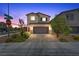 Charming two-story home featuring a well-maintained exterior, desert landscaping, and a paved driveway at 8261 Selenite St, Las Vegas, NV 89113