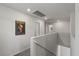 Hallway landing with neutral paint and carpet, offering access to other rooms at 8261 Selenite St, Las Vegas, NV 89113