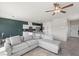 Inviting living room with open layout, neutral tones, tile flooring, and modern lighting fixtures at 8261 Selenite St, Las Vegas, NV 89113