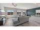 Bright living room with stylish furniture, neutral colors, and large windows offering ample natural light at 8261 Selenite St, Las Vegas, NV 89113