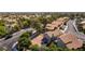 Home with a spacious backyard in a suburban neighborhood with mature trees at 8436 Kawala Dr, Las Vegas, NV 89128