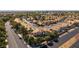 Aerial view of the home in a suburban neighborhood with mature trees and sidewalks at 8436 Kawala Dr, Las Vegas, NV 89128