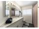 Modern bathroom with a large vanity, stylish mirror, and shower/tub combo at 8436 Kawala Dr, Las Vegas, NV 89128