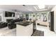 Open-concept kitchen with modern appliances and island that flows into the living area at 8436 Kawala Dr, Las Vegas, NV 89128