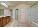 Bathroom with double sinks, vanity, tile floor, and glass shower at 8448 Cambria Cellars Ct, Las Vegas, NV 89139