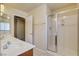 Modern bathroom featuring a white vanity with chrome fixtures and a glass-enclosed shower at 8448 Cambria Cellars Ct, Las Vegas, NV 89139